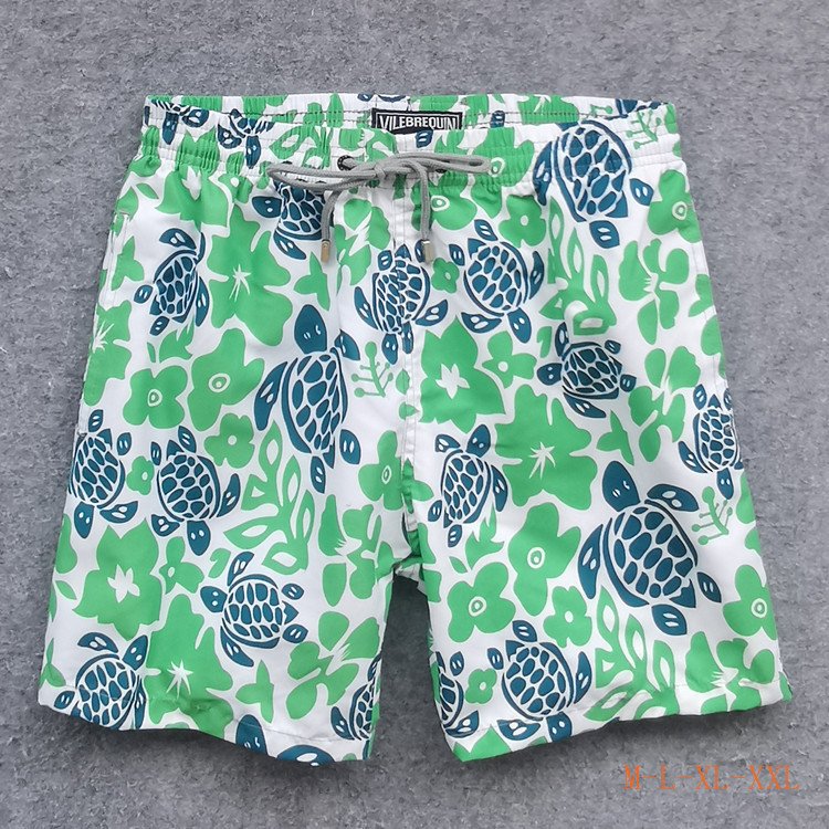 Green and navy lace-up custom board shorts